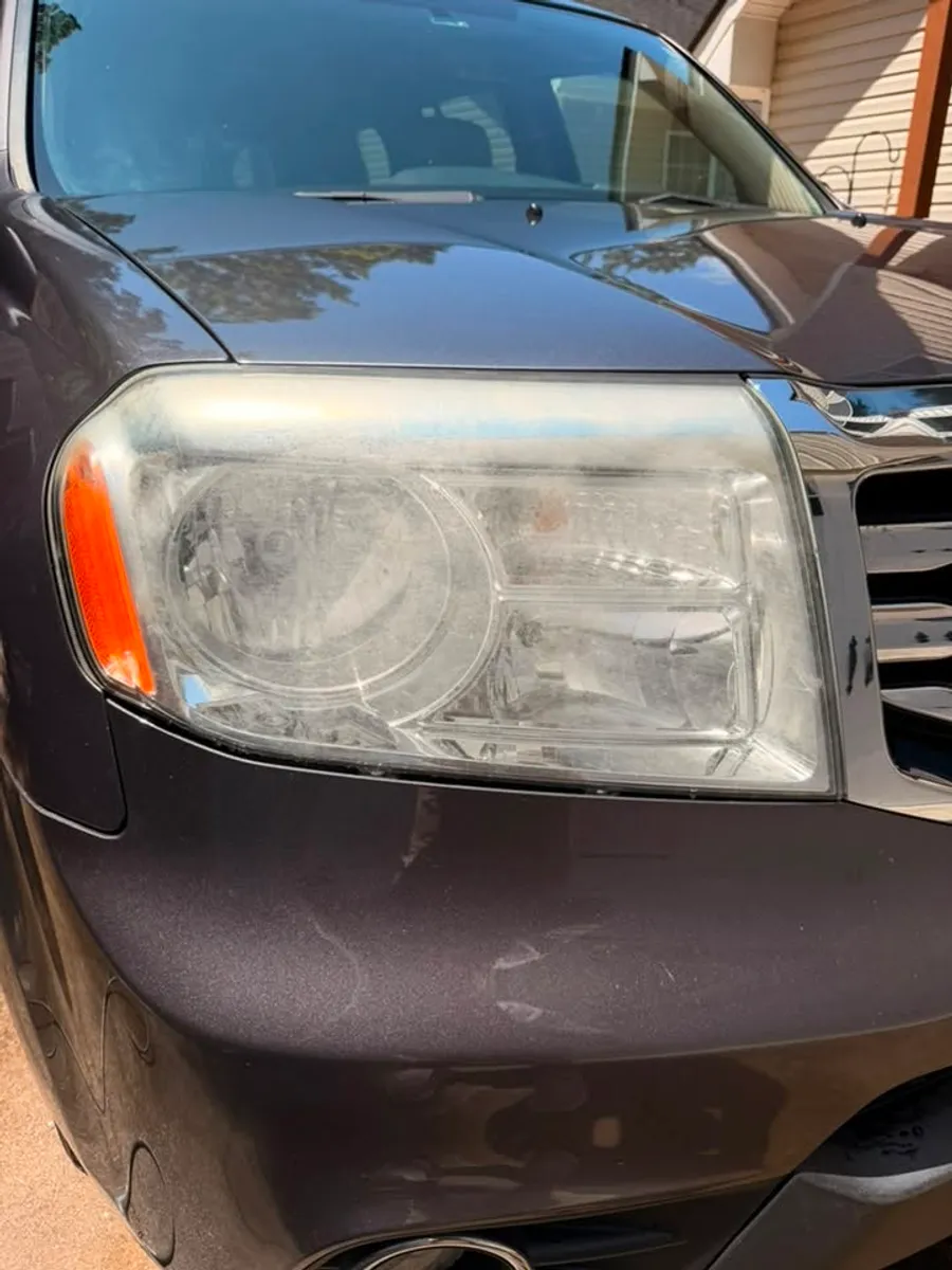 Before: Headlight restoration on a Honda Pilot in Chattanooga, TN - passenger side