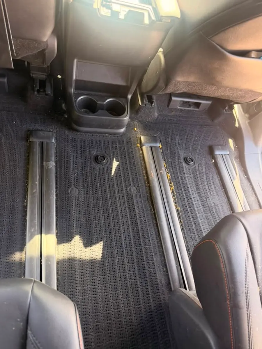 Before: Rear floor and seat rails deep cleaned in Chattanooga, TN