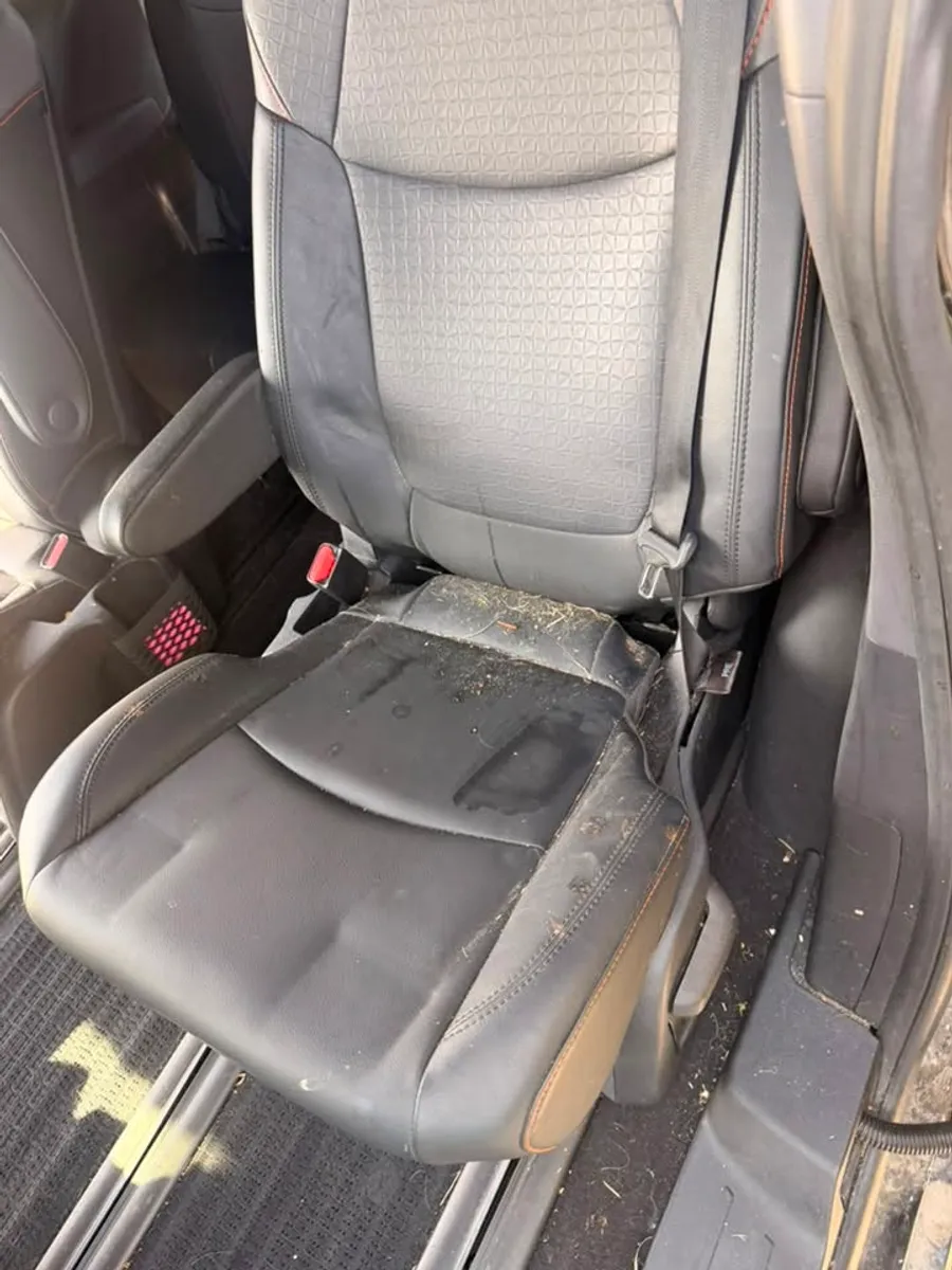 Before: Second-row seat deep clean in a Toyota Sienna in Chattanooga, TN